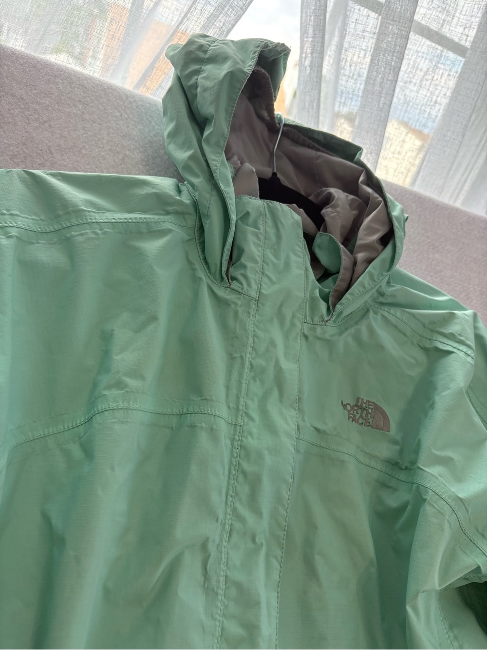 The North Face Mint Green Kids’ Hooded Rain Jacket